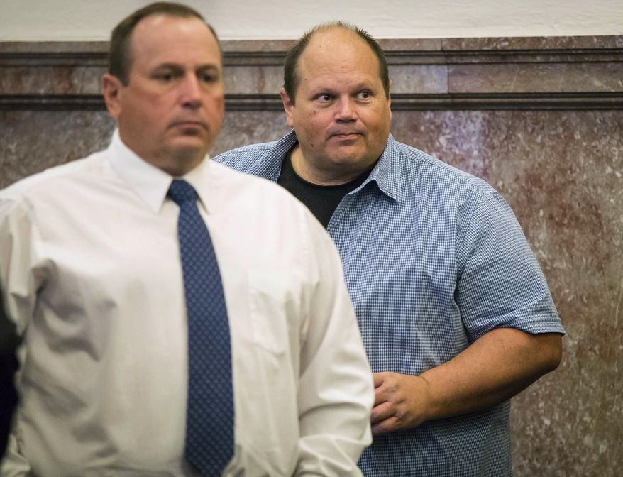 File - In this June 29, 2017 file photo, Tommy Tipton, left, and his brother Eddie Tipton, appear at the Polk County Courthouse in Des Moines, Iowa. The brothers have recently been sentenced for conspiring to use Eddie Tipton's job at the Multi-State Lottery Association to fix lottery drawings in several states between 2005 and 2011. A Colorado man who split a $4.8 million lottery jackpot in 2005 has filed a lawsuit alleging that his prize should be bigger because the other two winners have been linked to the brothers' conspiracy..(Rodney White/The Des Moines Register via AP File)