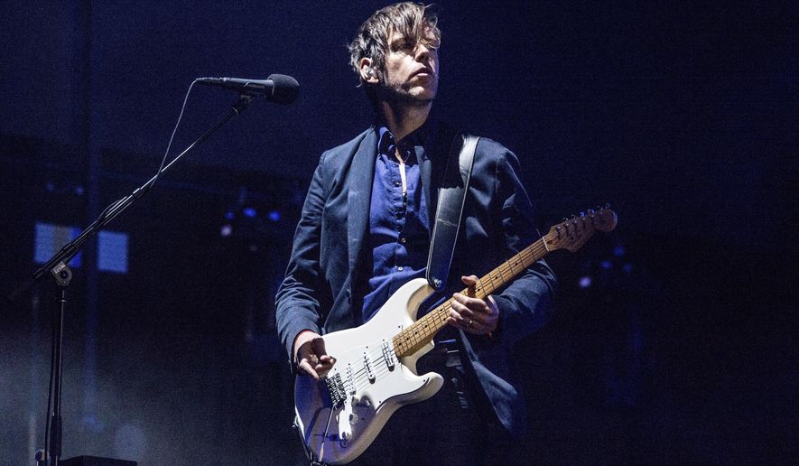 FILE - In this April 14, 2017, file photo, Ed O'Brien of Radiohead performs at Coachella Music & Arts Festival in Indio, Calif. Radiohead is among first-time nominees on the ballot for induction next year into the Rock and Roll Hall of Fame. (Photo by Amy Harris/Invision/AP, File)