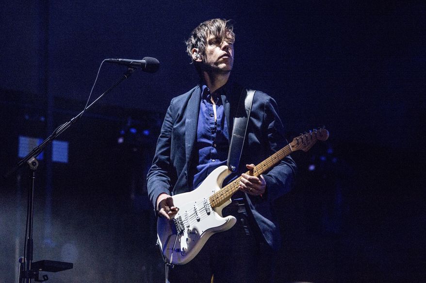 FILE - In this April 14, 2017, file photo, Ed O'Brien of Radiohead performs at Coachella Music & Arts Festival in Indio, Calif. Radiohead is among first-time nominees on the ballot for induction next year into the Rock and Roll Hall of Fame. (Photo by Amy Harris/Invision/AP, File)
