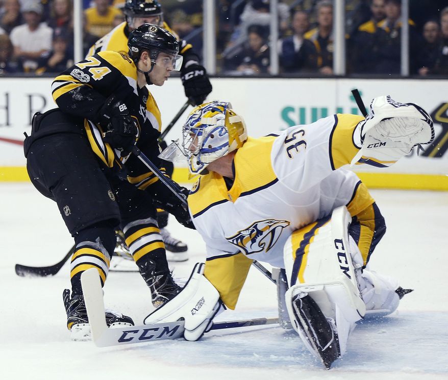 Boston Bruins' Jake DeBrusk (74) watches his shot for a goal on Nashville Predators' Alexei Emelin (35) during the second period of an NHL hockey game in Boston, Thursday, Oct. 5, 2017. (AP Photo/Michael Dwyer)