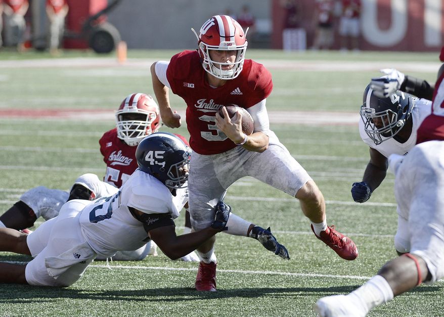 FILE - In this Saturday, Sept. 23, 2017 file photo, Indiana quarterback Peyton Ramsey (3) is tackled by Georgia Southern linebacker Rashad Byrd (45) during an NCAA college football game in Bloomington, Ind. All Indiana quarterback Peyton Ramsey wanted was a chance to prove he could be a Big Ten starter. Now that he’s earned the job, he must demonstrate he can keep it.Indiana plays Charleston Southern on Saturday, Oct. 6, 2017. (Chris Howell/The Herald-Times via AP, File)