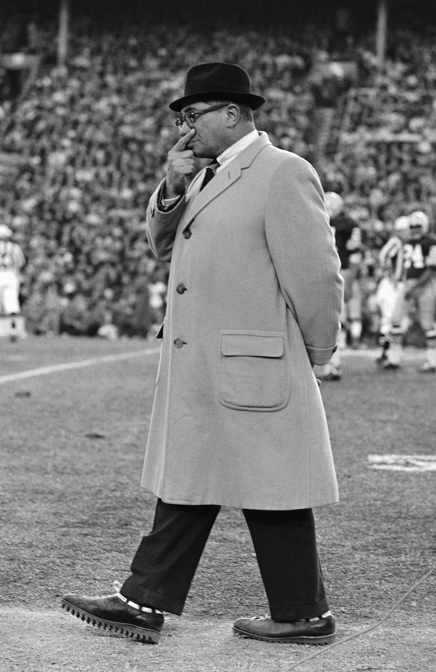 CORRECTS LOCATION TO DALLAS - FILE - In this Jan. 1, 1967, file photo, Green Bay Packers coach Vince Lombardi walks on the sideline during the team's 34-27 win over the Dallas Cowboys in the NFL championship game in Dallas. From Lombardi and Landry through Reggie and Brett, Troy and Emmitt. From the tundra of Lambeau to the gap in the Texas Stadium roof to Jerry's palace. Packers-Cowboys has been one of the NFL's most entertaining and meaningful rivalries for decades. (AP Photo, File)