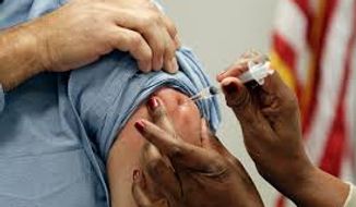 Medical professionals argue that some protection against the flu is better than none and encourage people to be vaccinated. (Associated Press/File)