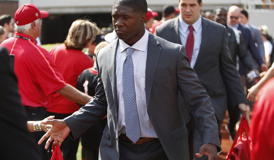 FILE - In this Sept. 2, 2017, file photo, Georgia junior linebacker Natrez Patrick (6) enters Sanford Stadium during the Dawg Walk before an NCAA college football game against Appalachian State, in Athens, Ga. Patrick could be facing a four-game suspension following his second arrest on marijuana charges in three years. Patrick is tied for third on the team with 17 tackles and his status for Saturday’s game at Vanderbilt is not clear.(Joshua L. Jones/Athens Banner-Herald via AP, File)