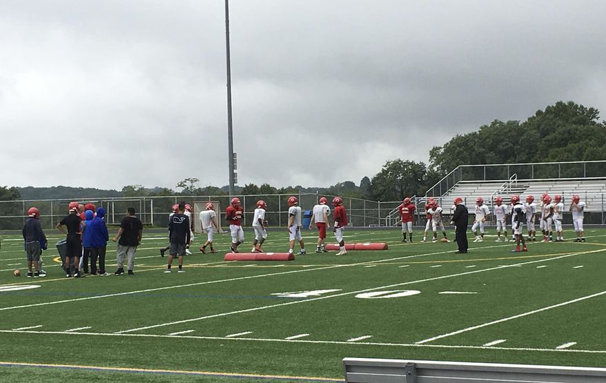 Members of the Centennial High School junior varsity football team practice at the school's varsity stadium in Ellicott City, Md., Wednesday, Sept. 6, 2017. Centennial decided not to field a varsity team this year because not enough boys wanted to play. Nationwide, participation in high school football is declining, in part because of concerns about head injuries. (AP Photo/Ben Nuckols)