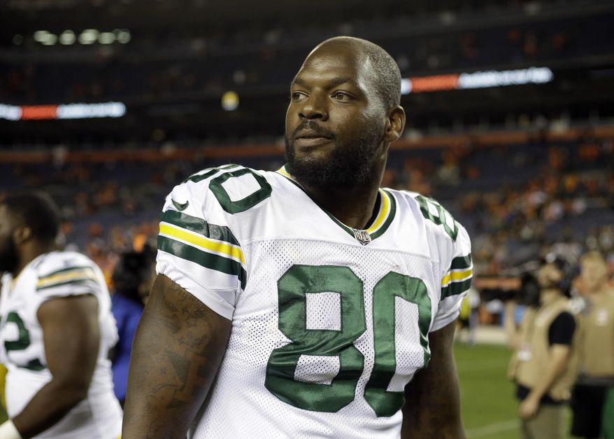 FILE - In this Aug. 26, 2017, file photo, Green Bay Packers tight end Martellus Bennett (80) smiles after an NFL preseason football game against the Denver Broncos, in Denver. Bennett always has a way with words. This week's entertaining analogy from the Green Bay Packers' tight end had to do with baking cakes. (AP Photo/Jack Dempsey, File)