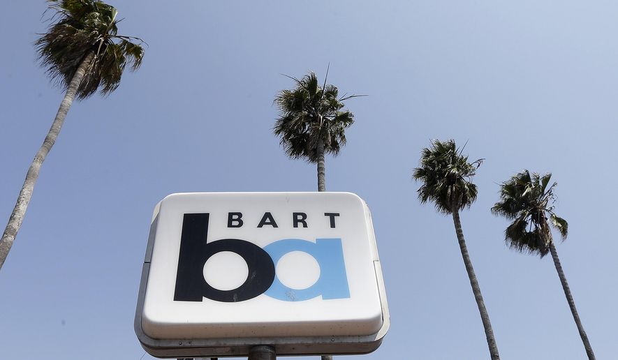 FILE--In this July 1, 2013, file photo, a Bay Area Rapid Transit (BART) sign is seen at the 24th Street Mission station in San Francisco. The California Public Utilities Commission on Friday, Oct. 6, 2017, issued a decision by an Administrative Law Judge that penalizes BART for two fatalities that occurred in 2013 in Contra Costa County. (AP Photo/Jeff Chiu, file)