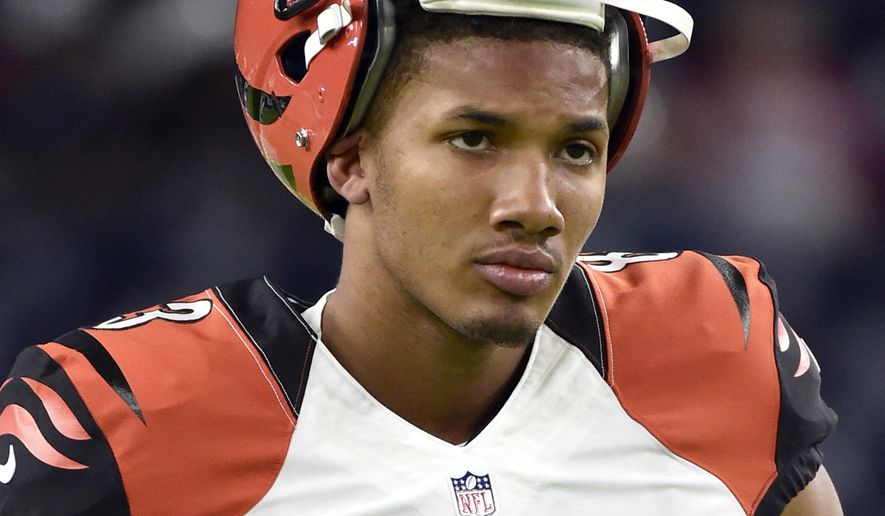 FILE - In this Dec. 24, 2016, file photo,  Cincinnati Bengals wide receiver Tyler Boyd (83) walks along sideline during warmup before an NFL football game against the Houston Texans, in Houston. Boyd was charged Thursday, Oct. 5, 2017, with owning a vape pen containing the active ingredient in marijuana, that police say they found when Boyd&#39;s friend crashed Boyd&#39;s car in the Pittsburgh suburbs in July. (AP Photo/Eric Christian Smith, FILE)