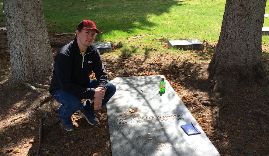 The author at the gravesite of Ernest Hemingway in Ketchum, Idaho. (Eric Althoff/The Washington Times)