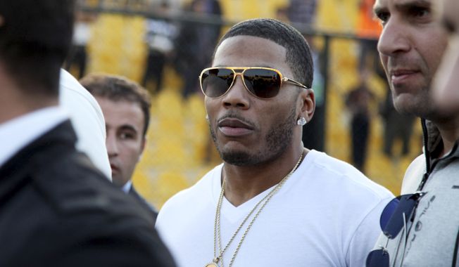 In March 13, 2015, file photo, rapper Nelly approaches the stage for a concert in Irbil, northern Iraq. On Dec. 14, 2017, prosecutors in King County, Wash., dismissed sex-assault charges against the musician after the alleged victim of an Oct. 7 rape declined to assist in the investigation, People magazine reported.  (AP Photo/Seivan M. Salim, File)
