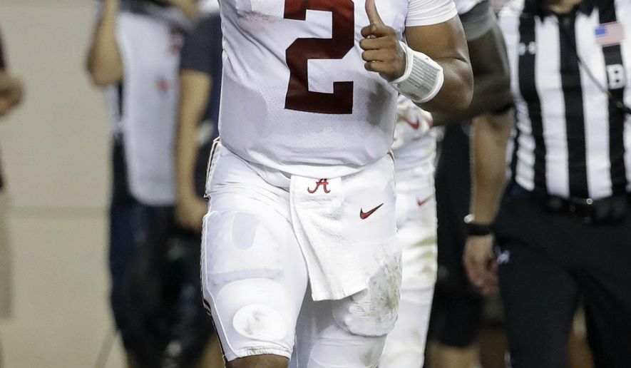 Alabama quarterback Jalen Hurts (2) celebrates after rushing for a touchdown against Texas A&M during the second quarter of an NCAA college football game Saturday, Oct. 7, 2017, in College Station, Texas. (AP Photo/David J. Phillip)