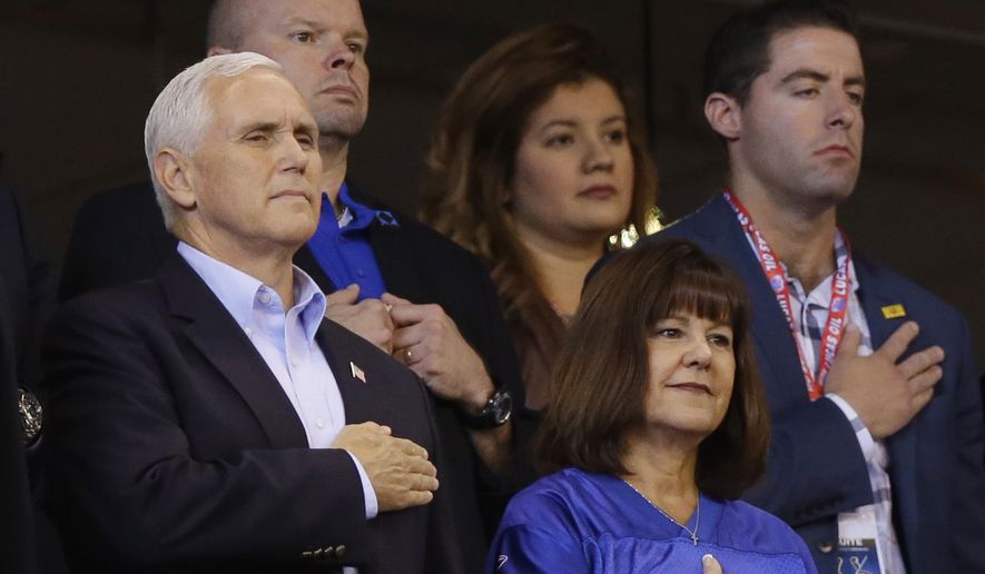 Vice President Mike Pence and his wife, Karen, stand during the playing of the national anthem before an NFL football game between the Indianapolis Colts and the San Francisco 49ers, Sunday, Oct. 8, 2017, in Indianapolis. (AP Photo/Michael Conroy)