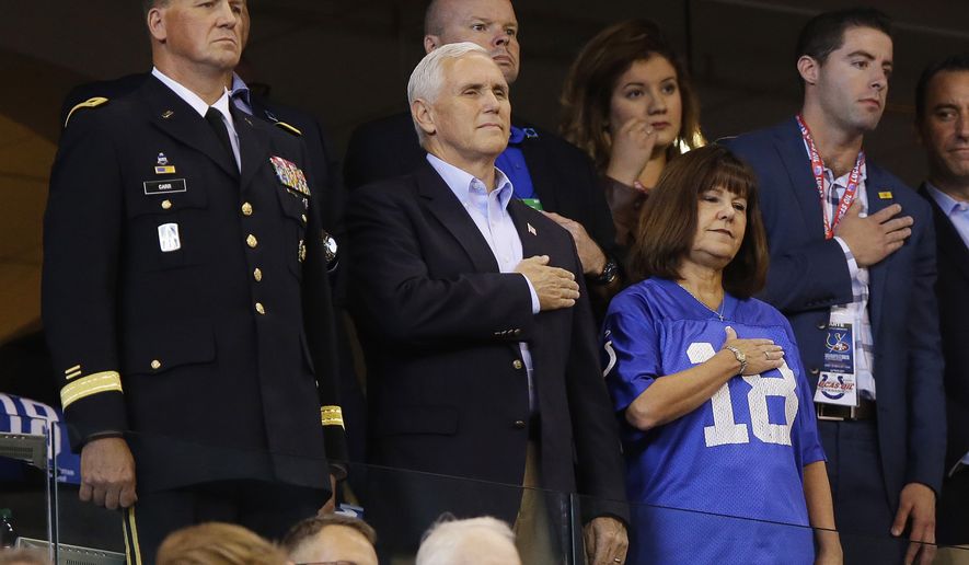Vice President Mike Pence, front center, stands during the playing of the national anthem before an NFL football game between the Indianapolis Colts and the San Francisco 49ers, Sunday, Oct. 8, 2017, in Indianapolis. (AP Photo/Michael Conroy)