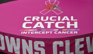 The stage used for the national anthem is decorated for Breast Cancer Awareness before an NFL football game between the New York Jets and the Cleveland Browns, Sunday, Oct. 8, 2017, in Cleveland. (AP Photo/David Richard)
