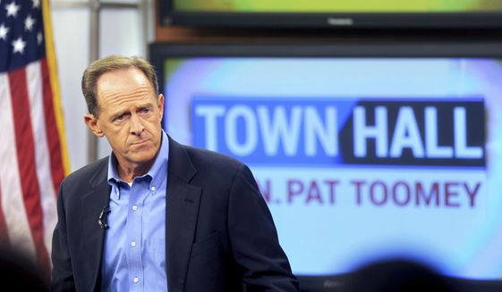 In this Aug. 31, 2017, file photo, Sen. Pat Toomey holds a town-hall meeting at the WLVT/PBS 39-TV studios in Bethlehem, Pa. (Tom Gralish/The Philadelphia Inquirer via AP, File)
