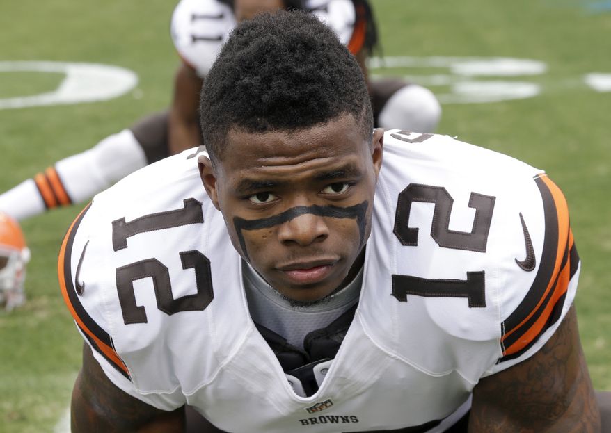 FILE - In this Dec. 21, 2014, file photo, Cleveland Browns' Josh Gordon (12) streteches before an NFL football game against the Carolina Panthers in Charlotte, N.C. Revealing he was “scared for my life,” suspended Browns wide receiver Josh Gordon is making his case to be reinstated by the NFL. Gordon, who was indefinitely suspended by the league before the 2015 season following another violation of the league’s substance-abuse policy, detailed his life-long drug abuse, the depths of his addiction and determination to turn his life around in a video released Tuesday, Oct. 10, 2017,  on “Uninterrupted,” a media platform for athletes produced by NBA star LeBron James.  (AP Photo/Bob Leverone, File)