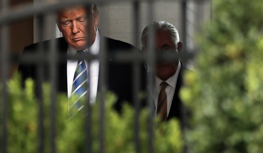 President Donald Trump, left, and Secretary of State Rex Tillerson, right, walk out together to speak to members of the media following their meeting at Trump National Golf Club in Bedminster, N.J., Friday, Aug. 11, 2017. (AP Photo/Pablo Martinez Monsivais)