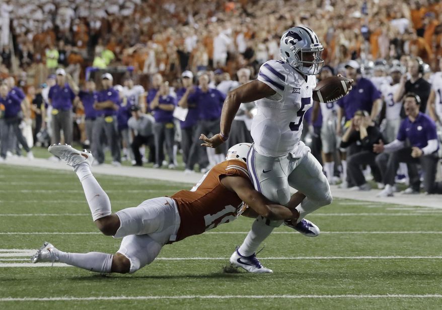 Kansas State quarterback Alex Delton (5) is stopped short of the goal line by Texas defensive back Brandon Jones (19) overtime in an NCAA college football game, Saturday, Oct. 7, 2017, in Austin, Texas. Texas won 40-34 in overtime. (AP Photo/Eric Gay)