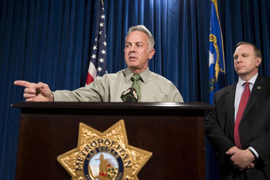 Clark County Sheriff Joe Lombardo, left, with Aaron C. Rouse, special agent in charge for the FBI in Nevada, discusses the Route 91 Harvest festival mass shooting at the Las Vegas Metropolitan Police Department headquarters in Las Vegas, Monday, Oct. 9, 2017. Law enforcement authorities on Monday made a significant change to the timeline of the mass shooting, saying the gunman shot a hotel security guard before he opened fire on concertgoers. (Erik Verduzco/Las Vegas Review-Journal via AP)