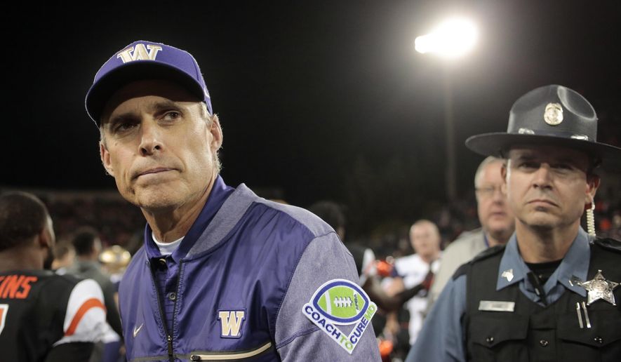 FILE - In this Sept. 30, 2017, file photo, Washington head coach Chris Petersen after an NCAA college football game, in Corvallis, Ore. Pac-12 After Dark, those West Coast TV games that start at about 11 p.m. on the East Coast, are the talk of the conference after Washington coach Chris Petersen weighed in. Some say it's a great showcase for the conference, but at least one coach said the next day, his team is basically zombies. (AP Photo/Timothy J. Gonzalez, File)