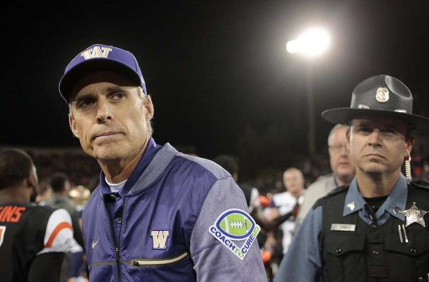 FILE - In this Sept. 30, 2017, file photo, Washington head coach Chris Petersen after an NCAA college football game, in Corvallis, Ore. Pac-12 After Dark, those West Coast TV games that start at about 11 p.m. on the East Coast, are the talk of the conference after Washington coach Chris Petersen weighed in. Some say it's a great showcase for the conference, but at least one coach said the next day, his team is basically zombies. (AP Photo/Timothy J. Gonzalez, File)