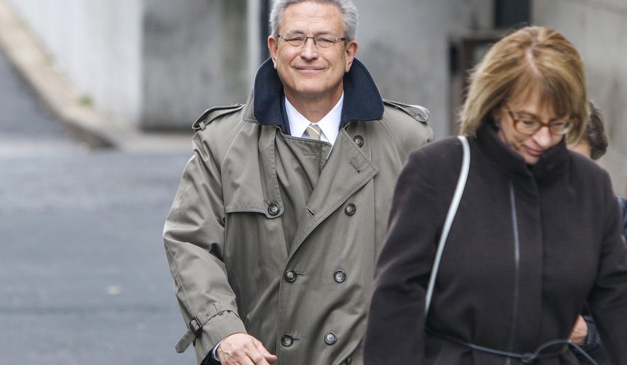 FILE - In this March 13, 2017, file photo, former Penn State Athletic Director Tim Curley leaves the Dauphin County Courthouse in Harrisburg, Pa.  after pleading guilty to endangering the welfare of a child in the in the Jerry Sandusky child molestation case. Curley has been released from jail after 2½ months and is now serving the house-arrest portion of his sentence in the Jerry Sandusky sex abuse scandal. Pennlive.com reports the 63-year-old defendant was released from the Centre County jail on Oct. 3. (Dan Gleiter/PennLive.com via AP, File)