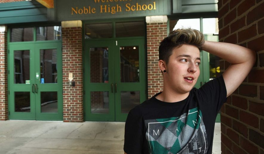 FILE - In this undated file photo, Stiles Zuschlag, a transgender teen, stands outside Noble High School in North Berwick, Maine. The Maine teen who was crowned homecoming king at his new school says he wants to use the attention to spread love and tolerance. (Deb Cram/Portsmouth Herald via AP, File)