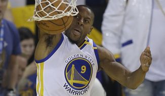 FILE - In this June 1, 2017, file photo, Golden State Warriors forward Andre Iguodala (9) dunks against the Cleveland Cavaliers during the first half of Game 1 of basketball&#39;s NBA Finals in Oakland, Calif. Iguodala wants nothing of this conversation, not if it places any credit on him for anything _ he just wants to keep leading the championship Golden State Warriors, re-signing to stay as a key backup ready to chase another title. (AP Photo/Ben Margot, File)