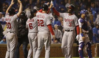 Washington Nationals&#39; Michael Taylor (3) celebrates after hitting a grand slam against the Chicago Cubs during the eighth inning of Game 4 of baseball&#39;s National League Division Series, Wednesday, Oct. 11, 2017, in Chicago. (AP Photo/Nam Y. Huh)