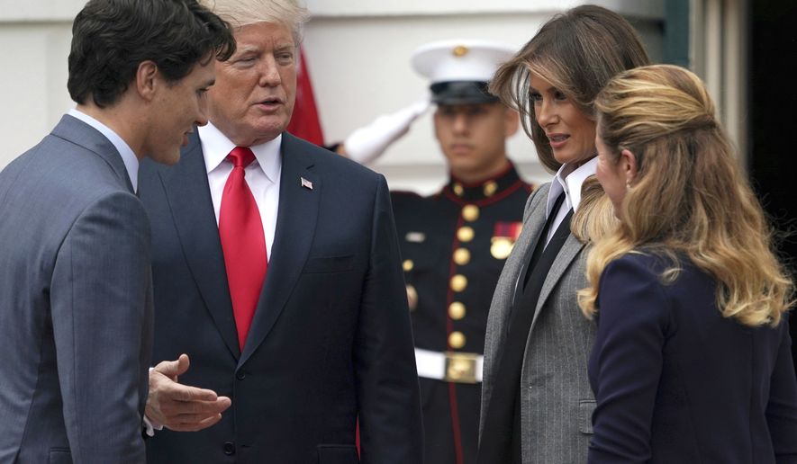 President Donald Trump and first lady Melania Trump greet Canadian Prime Minister Justin Trudeau and his wife Sophie Gregoire Trudeau as they arrive at the White House in Washington, Wednesday, Oct. 11, 2017. (AP Photo/Carolyn Kaster)