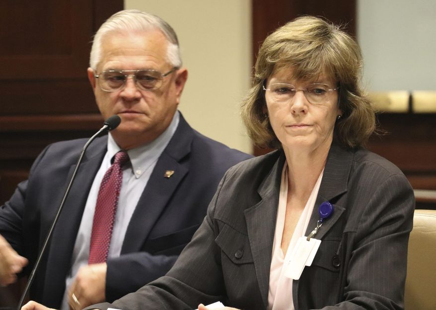 Correction Department Director Wendy Kelley testifies Wednesday, Oct. 11, 2017, at a meeting of the Charitable, Penal and Correctional Institutions Subcommittee of the Arkansas Legislative Council in Little Rock, Ark. The panel is looking into a recent uptick in violence at the state's prisons. With Kelley is Dale Reed, the department's chief deputy director. (AP Photo/Kelly P. Kissel)