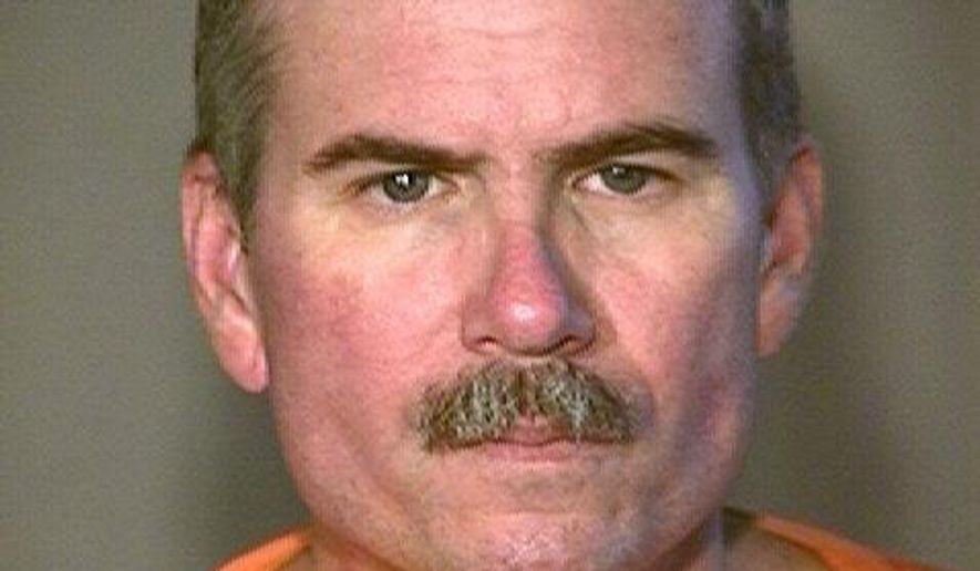 This undated booking photo provided by the Arizona Department of Corrections shows Jack Hudson, a former undercover narcotics officer serving life terms for killing two fellow law enforcement officers in Yuma 22 years ago. The Arizona Department of Corrections says 59-year-old Hudson died Tuesday, Oct. 11, 2017, of natural causes in the health unit at the Lewis prison complex in Buckeye, a Phoenix suburb. (Arizona Department of Corrections via AP)