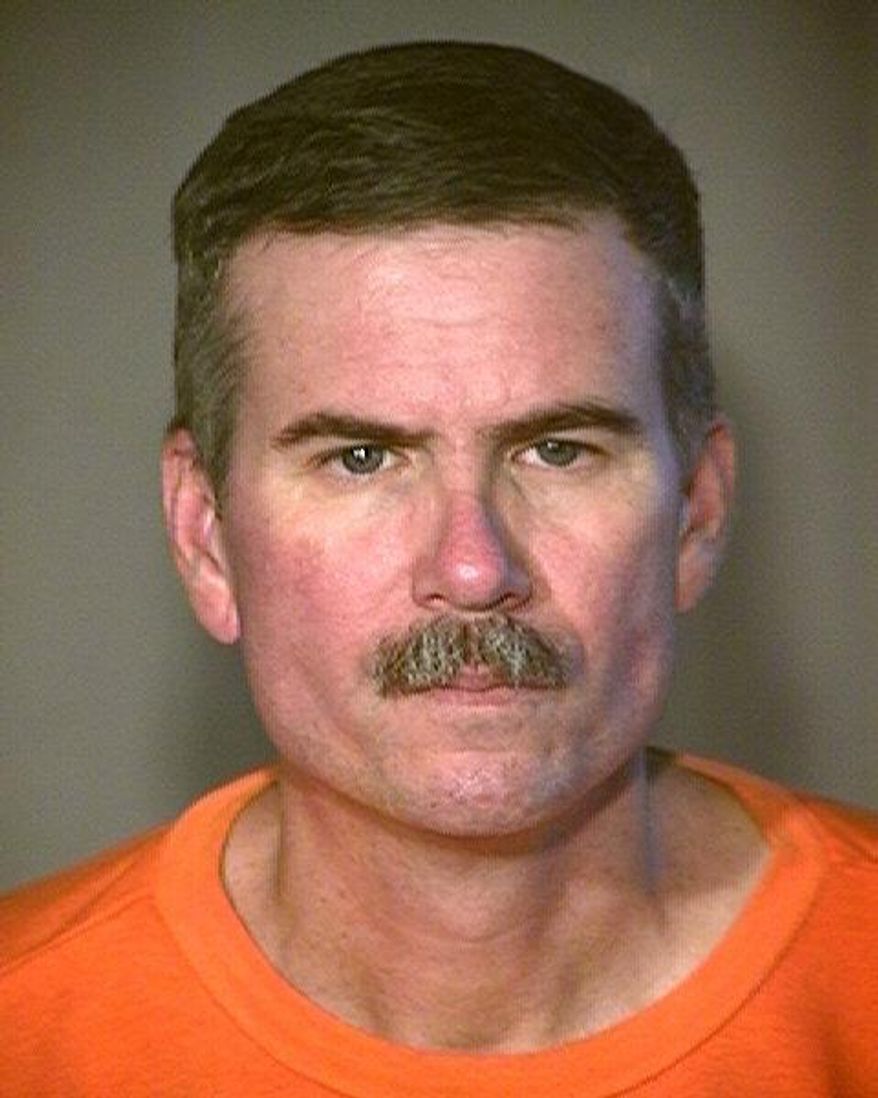 This undated booking photo provided by the Arizona Department of Corrections shows Jack Hudson, a former undercover narcotics officer serving life terms for killing two fellow law enforcement officers in Yuma 22 years ago. The Arizona Department of Corrections says 59-year-old Hudson died Tuesday, Oct. 11, 2017, of natural causes in the health unit at the Lewis prison complex in Buckeye, a Phoenix suburb. (Arizona Department of Corrections via AP)