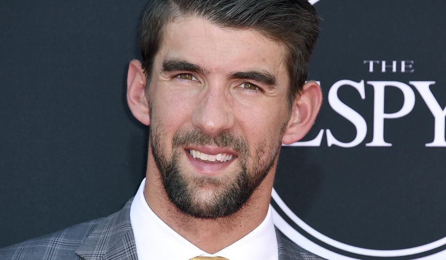 FILE - In this July 12, 2017 file photo, Olympic swimmer Michael Phelps arrives at the ESPYS in Los Angeles. Phelps appears in the documentary, “Angst” to share his story of being bullied and depressed. (Photo by Jordan Strauss/Invision/AP, File)