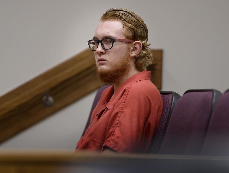 FILE - In this Aug. 23, 2017, file photo, defendant Tyerell Przybycien, of Spanish Fork, waits for the start of his preliminary hearing, in 4th District Court, Provo, Utah. A Utah judge was considering Wednesday, Oct. 11, 2017, whether Przybycien, an 18-year-old accused of filming the suicide of a high school classmate should stand trial for murder after prosecutors said he bought a rope and helped the girl tie a noose before she hanged herself. (Scott Sommerdorf/The Salt Lake Tribune via AP, File)