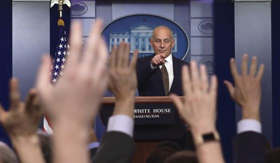 A calm White House chief of staff John Kelly wrangles the press corps on Thursday afternoon. (AP Photo/Susan Walsh)