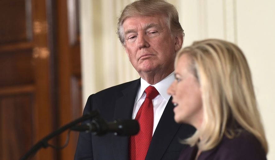President Donald Trump, left, listens as Kirstjen Nielsen, right, a cybersecurity expert and deputy White House chief of staff, speaks in the East Room of the White House in Washington, Thursday, Oct. 12, 2017, after Trump announced that she is his choice to be the next Homeland Security Secretary. (AP Photo/Susan Walsh)