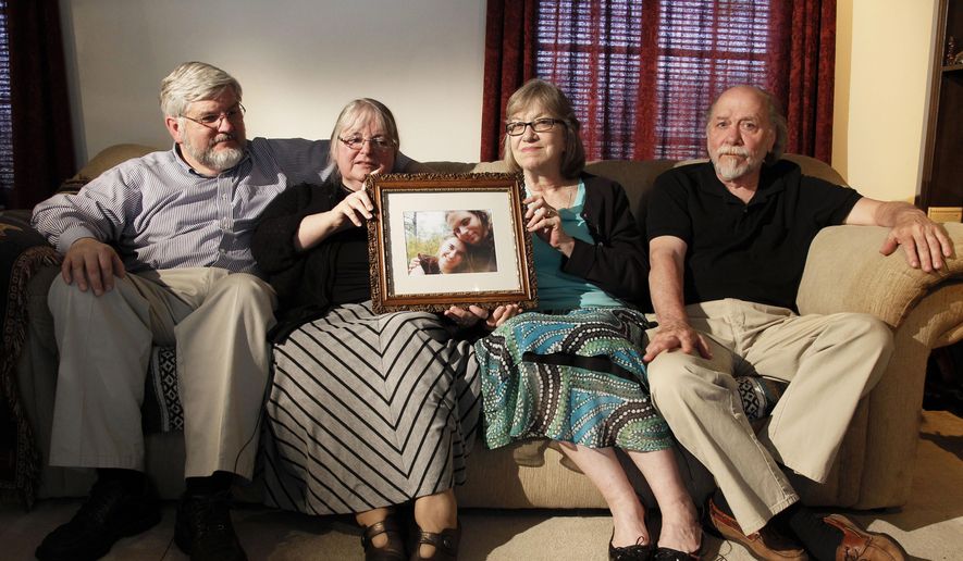 In this June 4, 2014, file photo, from left, Patrick Boyle, Linda Boyle, Lyn Coleman and Jim Coleman hold photo of their kidnapped children, Joshua Boyle and Caitlan Coleman, who were kidnapped by the Taliban in late 2012, Wednesday, June 4, 2014, in Stewartstown, Pa.  Pakistan&#x27;s military says soldiers have recovered five Western hostages held by the Taliban for years. Pakistan&#x27;s army did not name those held, only saying it worked with U.S. intelligence officials to track down the hostages and free them after discovering they had been brought into Pakistan.  (AP Photo/Bill Gorman, File)