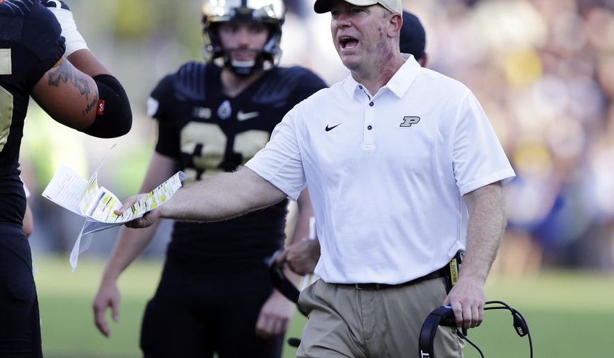 FILE - In this Sept. 23, 2017, file photo, Purdue head coach Jeff Brohm yells to an official during the first half of an NCAA college football game against Michigan in West Lafayette, Ind. rejuvenated Boilermakers rank 36th in scoring defense, 52nd in pass defense, 57th in total defense and 66th in rushing defense. (AP Photo/Michael Conroy, File)