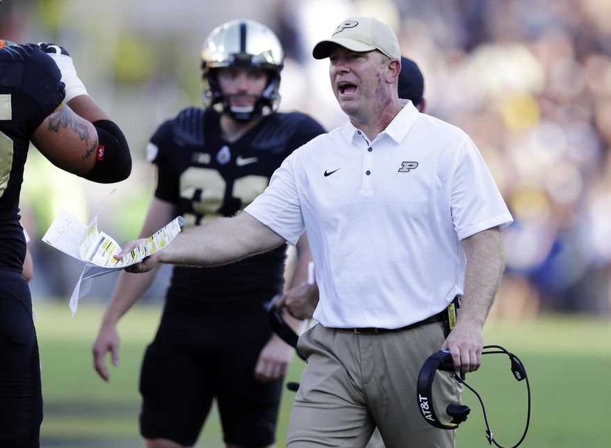 FILE - In this Sept. 23, 2017, file photo, Purdue head coach Jeff Brohm yells to an official during the first half of an NCAA college football game against Michigan in West Lafayette, Ind. rejuvenated Boilermakers rank 36th in scoring defense, 52nd in pass defense, 57th in total defense and 66th in rushing defense. (AP Photo/Michael Conroy, File)