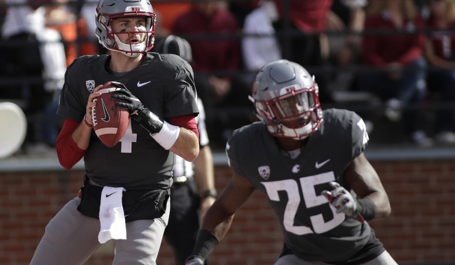 FILE - In this Sept. 16, 2017, file photo, Washington State quarterback Luke Falk (4) looks to pass during an NCAA college football game against Oregon State in Pullman, Wash. After arriving at Washington State as a walk-on, Falk will leave as one of the most productive passers in Pac-12 history. He has thrown for 12,893 yards with 108 touchdowns for his college career, setting school records for career TD passes, passing yardage and total offense. (AP Photo/Young Kwak, File)
