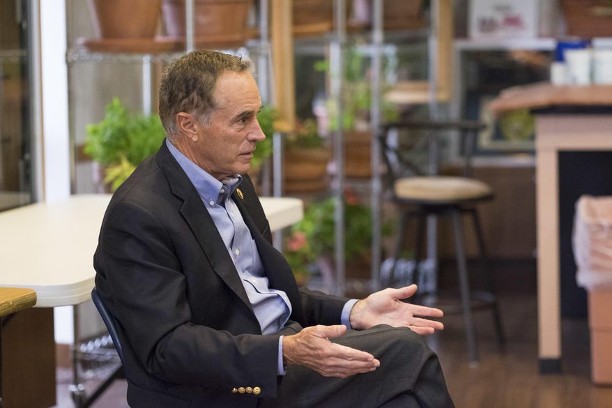 This photo taken Oct. 26, 2016, shows Rep. Chris Collins speaking to Lockport High School's Young Republicans Club in Lockport, N.Y. The House Ethics Committee said Thursday, Oct. 12, 2017, it was extending its review of republican Collins, whose stock market trades prompted an advocacy group to request an investigation for possible violation of insider trading or conflict of interest(Joed Viera /The Union-Sun & Journal via AP)