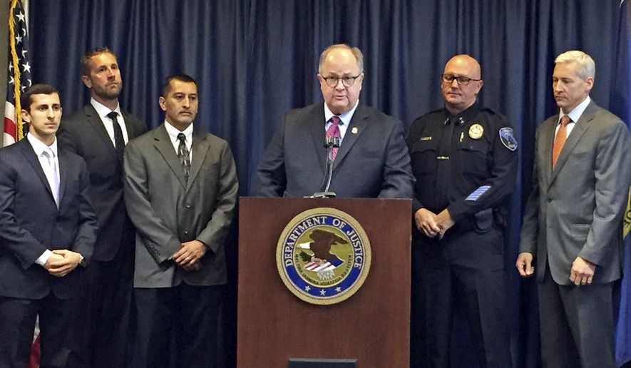 U.S. Attorney for Idaho Bart Davis, center at podium, speaks during a press conference in Boise, Idaho, on Thursday, Oct. 12, 2017. Davis said he believes a new offshoot of the street and prison gang Surenos is close to being eradicated after a series of indictments in state and federal court. Also pictured from left to right are: Special Assistant U.S. Attorney Francis Zabari, Alcohol Tobacco and Firearms agent Ken Cooper, Idaho Department of Correction Director Henry Atencio, Davis, Caldwell Police Chief Frank Wyant and FBI supervisor senior resident agent Doug Hart. (AP Photo/Rebecca Boone)