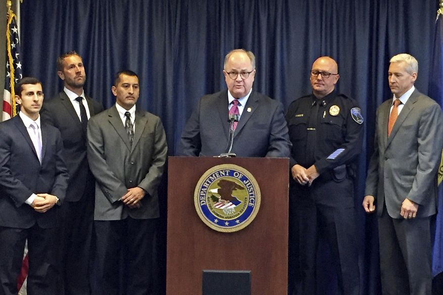 U.S. Attorney for Idaho Bart Davis, center at podium, speaks during a press conference in Boise, Idaho, on Thursday, Oct. 12, 2017. Davis said he believes a new offshoot of the street and prison gang Surenos is close to being eradicated after a series of indictments in state and federal court. Also pictured from left to right are: Special Assistant U.S. Attorney Francis Zabari, Alcohol Tobacco and Firearms agent Ken Cooper, Idaho Department of Correction Director Henry Atencio, Davis, Caldwell Police Chief Frank Wyant and FBI supervisor senior resident agent Doug Hart. (AP Photo/Rebecca Boone)