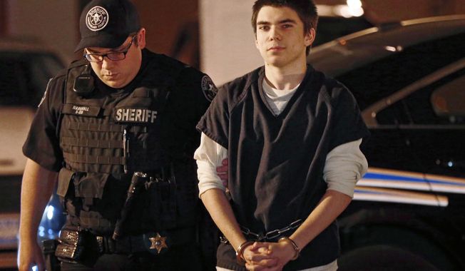 FILE – In this Oct. 26, 2015, file photo, Alex Hribal, right, is escorted to a bail hearing in Greensburg, Pa. Hribal is charged as an adult with stabbing 20 fellow students and a security guard April 9, 2014, at his suburban Pittsburgh high school. Defense attorney Patrick Thomassey told the Tribune-Review Wednesday, Oct. 11, 2017, there is a &amp;quot;good chance&amp;quot; the charges against Hribal will be resolved before his trial, which is scheduled to begin Nov. 13. (AP Photo/Keith Srakocic, File)