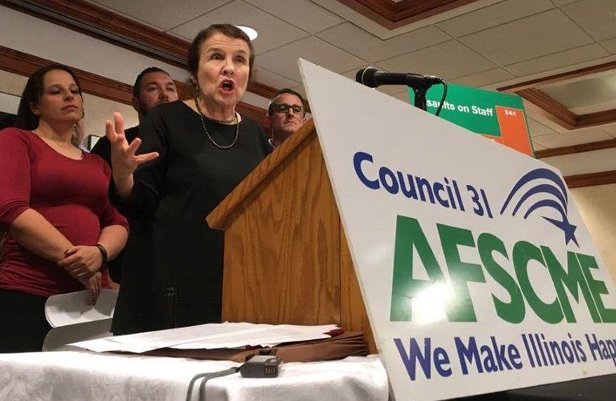 American Federation of State, County and Municipal Employees (AFSCME) Council 31 Executive Director Roberta Lynch speaks at a news conference Thursday, Oct. 12, 2017, in Springfield, Ill. The union representing corrections officers says inmate attacks on state employees have increased 51 percent since 2015. AFSCME says the Illinois Department of Corrections is reclassifying violent inmates to lower security levels to save money. Those inmates are transferred to medium-security prisons which are less costly to run. (AP Photo/John O'Connor)