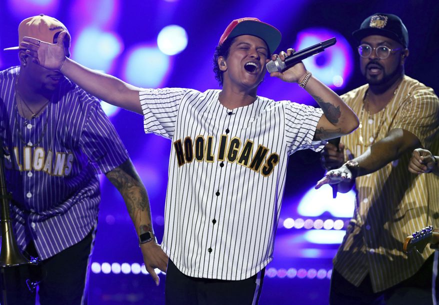 FILE - In this Sunday, June 25, 2017, file photo, Bruno Mars performs "Perm" at the BET Awards at the Microsoft Theater in Los Angeles. Mars is the top nominee with eight nods at the American Music Awards, while The Chainsmokers, Drake, Kendrick Lamar, Ed Sheeran and The Weeknd all earned five nominations each. The show will broadcast live from the Microsoft Theater in Los Angeles on Nov. 19 at 8:00 p.m. Eastern on ABC. (Photo by Matt Sayles/Invision/AP, File)