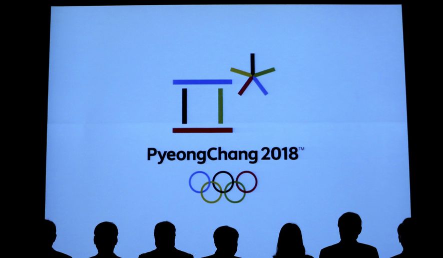 In this Sept. 1, 2017, photo, Lee Hee-beom, center, president of the Pyeongchang Organizing Committee for the 2018 Olympic and Paralympic Winter Games, and attendance are silhouetted as they participate in a launching ceremony of the commemorative coins and bank notes for the 2018 Winter Olympic Games in Seoul, South Korea. The Winter Olympics coming to South Korea in February offer an example of the Olympian efforts often required to meet corporate sponsorship goals. Tokyo tells a different story: The coffers are already overflowing for the 2020 Summer Games. It’s a tale of two cities and two Olympics - winter and summer. (AP Photo/Ahn Young-joon)