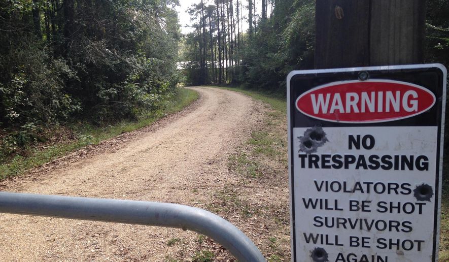 The entrance to Ryan Sharpe's home is shown in Clinton, La., Thursday, Oct. 12, 2017. Sharpe, a 36-year-old plumbing company owner, was charged in the killing of three people and the wounding of another in a string of attacks that authorities said started in July in a rural area north of Baton Rouge and ended this week with the death of a Boy Scouts employee. (AP Photo/Michael Kunzelman)