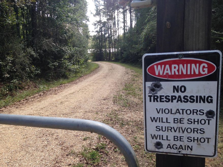 The entrance to Ryan Sharpe's home is shown in Clinton, La., Thursday, Oct. 12, 2017. Sharpe, a 36-year-old plumbing company owner, was charged in the killing of three people and the wounding of another in a string of attacks that authorities said started in July in a rural area north of Baton Rouge and ended this week with the death of a Boy Scouts employee. (AP Photo/Michael Kunzelman)